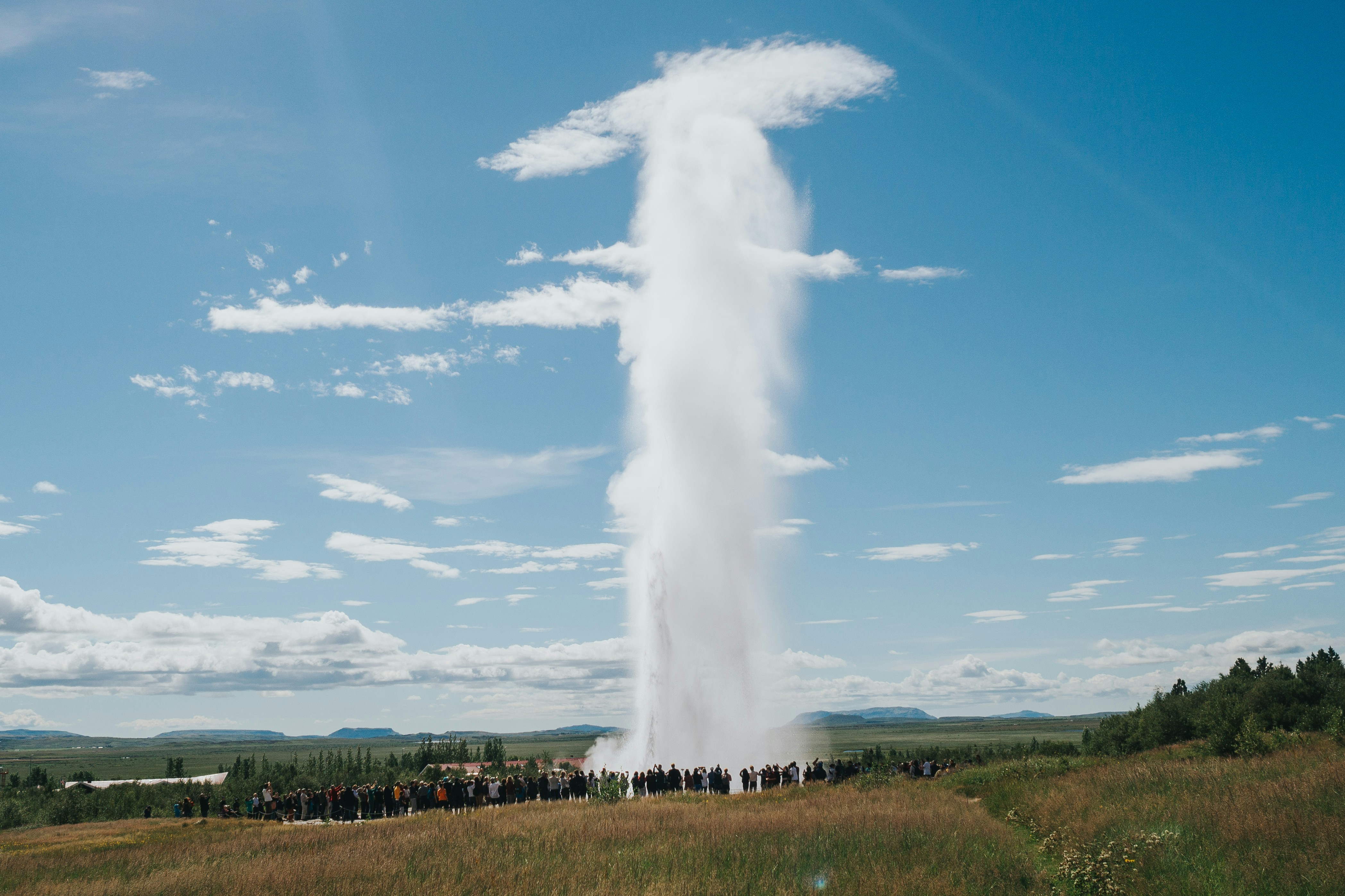 Steaming hot springs and colourful mineral deposits at Geysir geothermal area