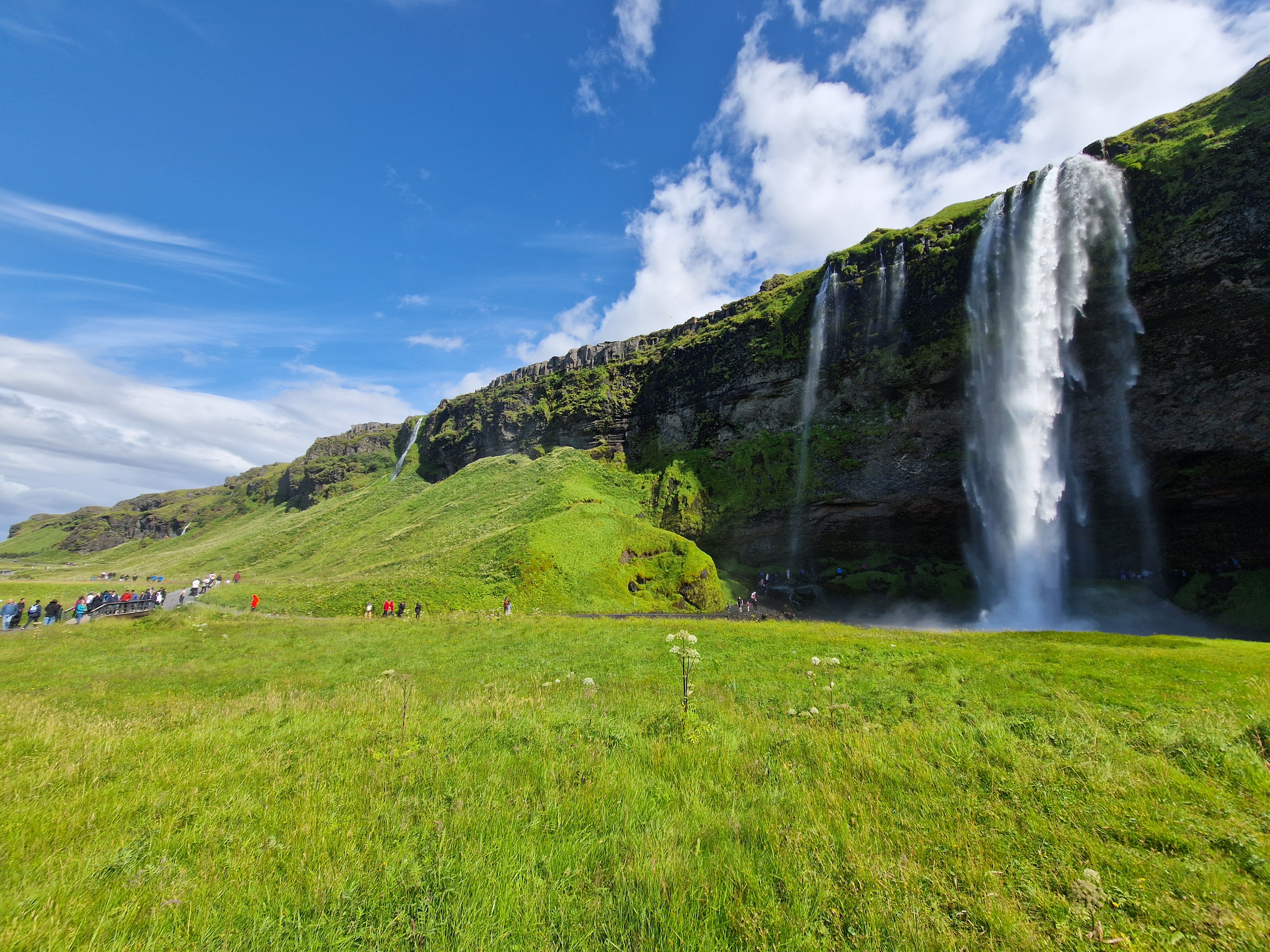 Walking path leading behind Seljalandsfoss waterfall