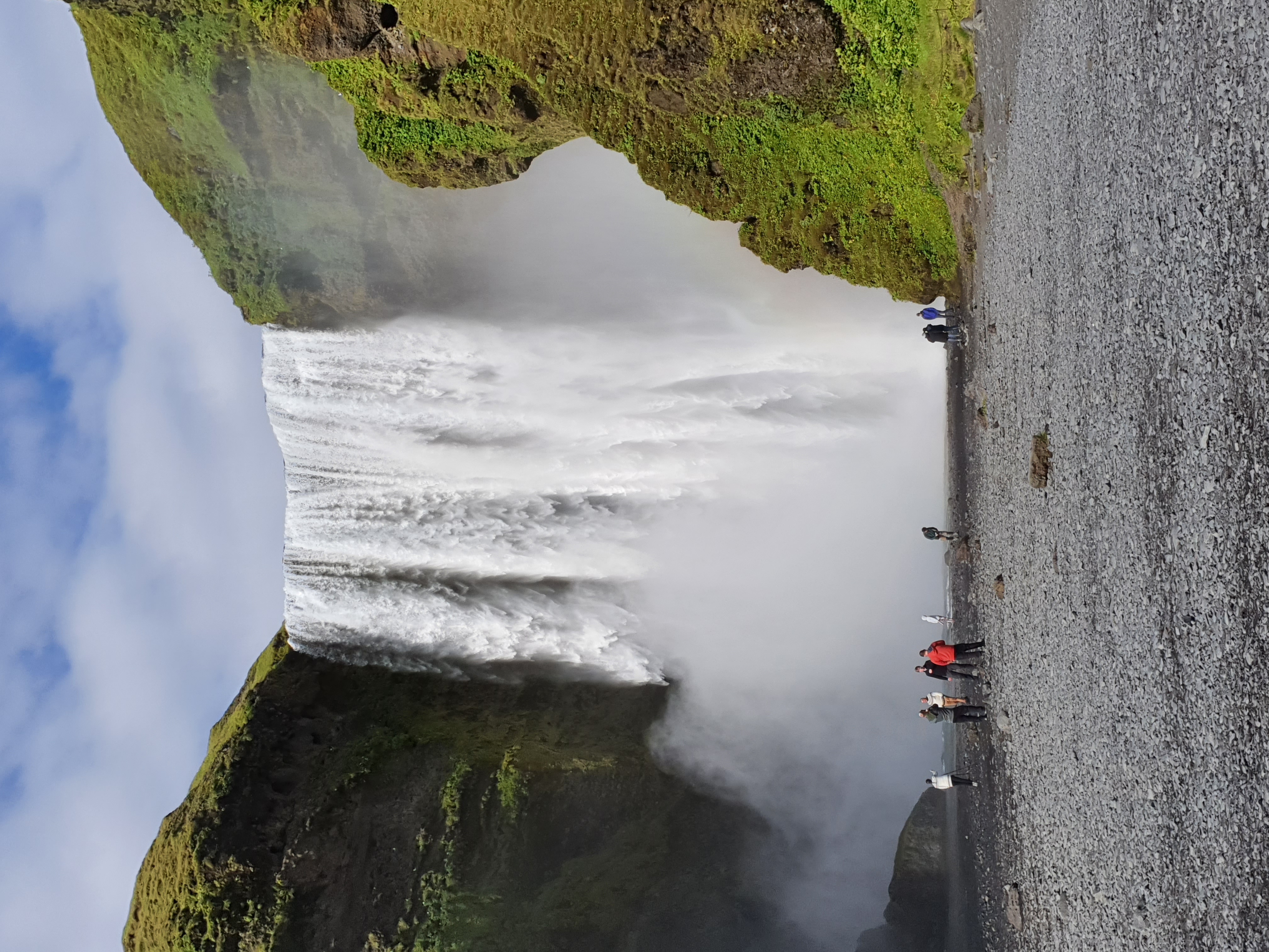 Skógafoss waterfall with rainbow in the mist