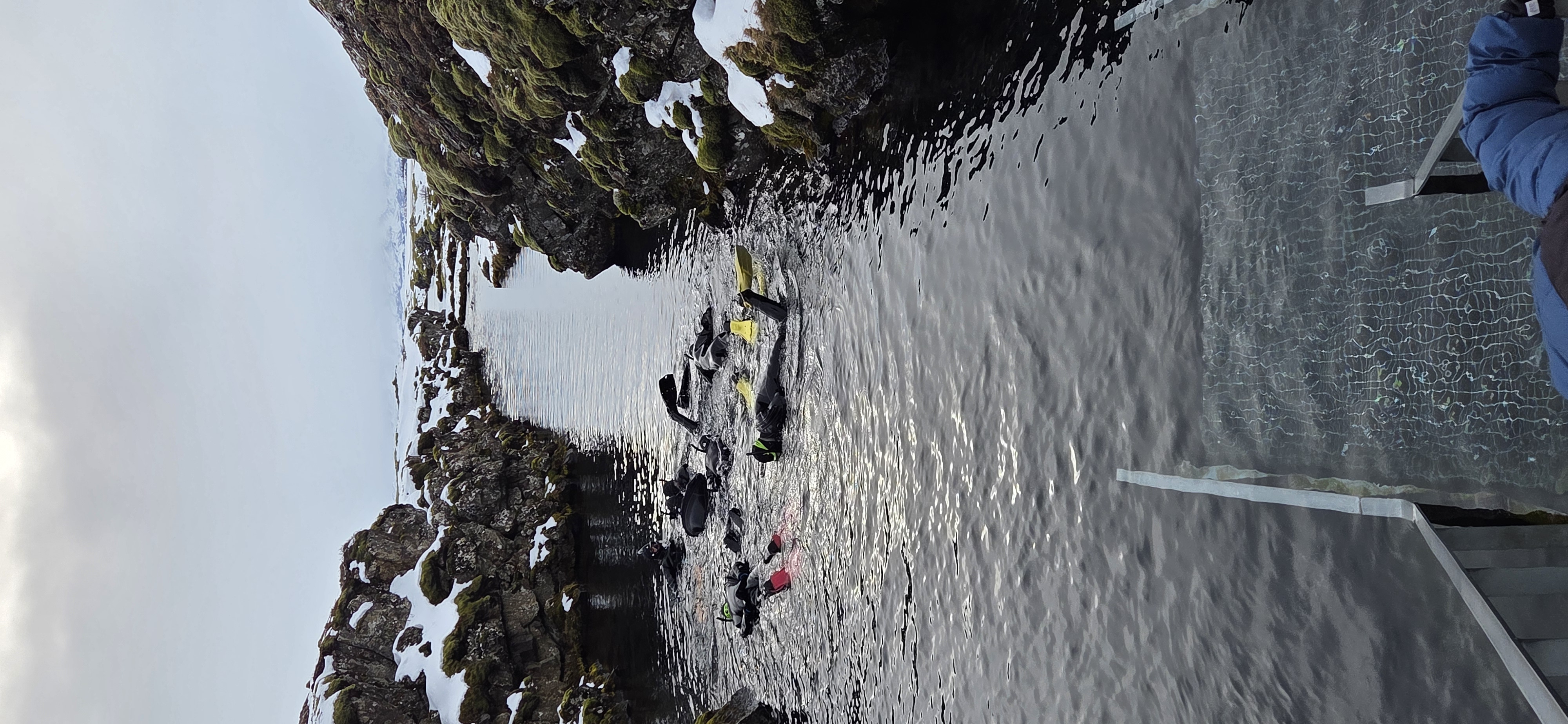 Snorkelers in Silfra fissure at Þingvellir in winter